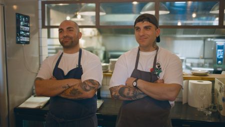 Brothers Niccolò, left, and Manuel Trecastelli wait eagerly for Stanley Tucci's reaction to their sandwich.(credit: National Geographic)