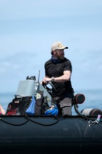 Aldo Kane steers the Zodiac. (National Geographic/Mario Tadinac)