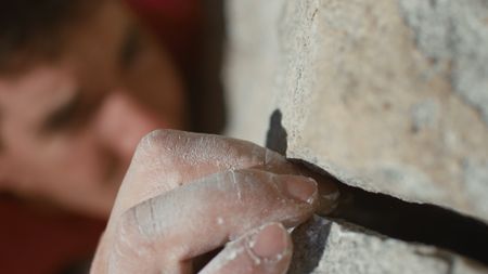 Alex Honnold uses a crack in the rock to gain purchase as he free solos.   (photo credit: National Geographic)