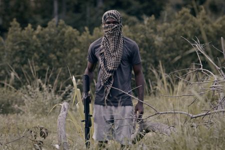 A reenactment of a Somali pirate armed with a sub-machine gun. (©2019 MCN International Pte Ltd. All Rights Reserved.)