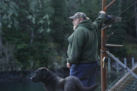 Tim 'Curly' Leach uses a hoist to get a deer up to his property. (National Geographic/Mickey Ramos)