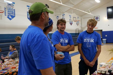 Drs. Ben and Erin Schroeder talk with their kids Charlie and Chase Schroeder at the 5K fundraiser. (National Geographic)