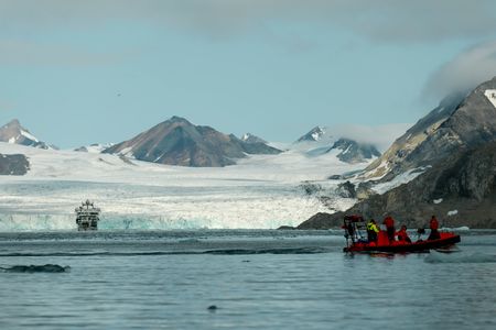 Crew George Scott, Nigel Hussey, Melissa Marquez, Eric Ste-Marie, and Aldo Kane riding in the FRC off Svalbard, Norway. (National Geographic/Mario Tadinac)
