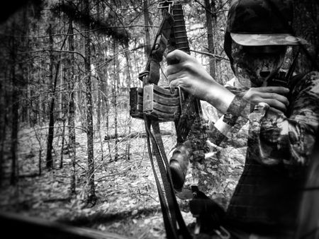 A narco stands guard with a rifle in Sinaloa Mountains. (Nick Quested)