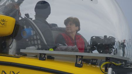 Zoleka Filander and oceanographer Edith Widder board the OceanXplorer's submersible to look at the squid that inhabit the deep waters of the Azores. (National Geographic)