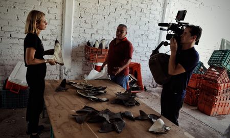 Mariana van Zeller interviews the "Finman" about selling shark fins. (National Geographic)