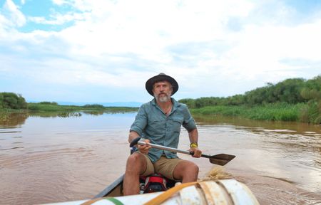 National Geographic Explorer Dr. Steve Boyes paddles down the Kagera River in Rwanda, collecting baseline data on the health of the river. (National Geographic/Philip Jones)