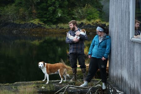Oliver Johnson and Breanna Miethe relax at home with their dogs, Belle and Tigger. (National Geographic/Wayne Moss)