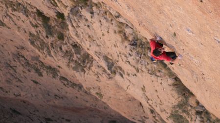 Alex Honnold free solos Les Rivieres Pourpres.  (photo credit: National Geographic)