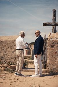 TUCCI IN ITALY - “Sardinia” - Stanley Tucci visits the cemetery on Tavolara with 92-year-old Tonino Bertoleoni.  (National Geographic/Matt Holyoak)TONINO BERTOLEONI, STANLEY TUCCI