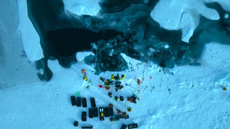 Aerial shot over looking the dive site on the ice during the North Pole shoot. (credit: National Geographic)