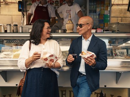 Stanley enjoys lampredotto, which is something only Florentines seem to cook, with food writer Emiko Davies.  (credit: National Geographic/Matt Holyoak)