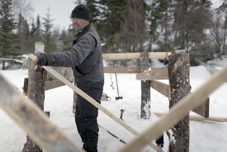Joel Jacko builds a dock in the winter season. (National Geographic/Wayne Shockey)