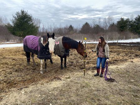Michele stands with her two horses, one of which she thinks has colic. (National Geographic/Bobby Falcon-Hart)