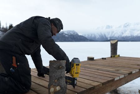 Joel Jacko builds a dock in the winter season. (National Geographic/Wayne Shockey)