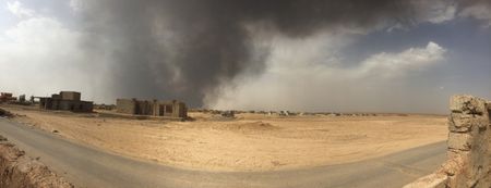 IRAQ - After leaving Qayarrah, ISIS sets oil fires as a parting gift for the villagers. (photo credit:  Junger Quested Films LLC/Nick Quested)