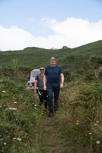 Gordon Ramsay and Andres Ruano walking towards Costa da Morte. (National Geographic/Justin Mandel)