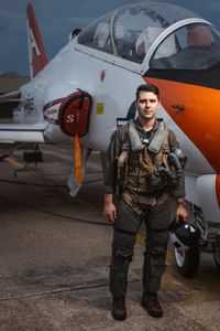 Student LTJG Marcus Figueroa poses next to a T-45. (Credit: National Geographic/Freddie Claire)