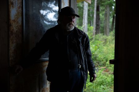 Terry Simpson is grateful for his neighbors' help in building him a new cabin. (National Geographic/Robert Jolley)