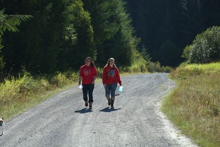 Breanna Miethe and Veronica Arrants pick berries. (National Geographic/Wayne Moss)