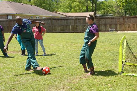 Dr. Ferguson takes a shot on goal against vet tech Jordan. (National Geographic for Disney/Nicholas Reaves)