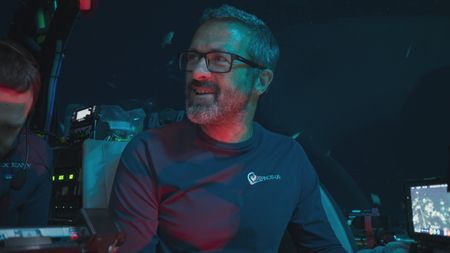 Pedro Afonso reacts to the sheer size and anatomy of the sixgill shark, commenting that it looks like a prehistoric creature. (National Geographic)