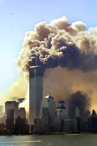 Clouds of smoke rise from the burning upper floors just before the second of the twin towers of the World Trade Center in New York collapsed on Sept. 11, 2001. (Hubert Boesl/picture-alliance/dpa/AP Images)