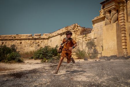 Avianius, played by Frankie Treadaway, flees Pompeii, sprinting through the city gates to escape the pyroclastic flow. (National Geographic/Darrin Zammit Lupi)
