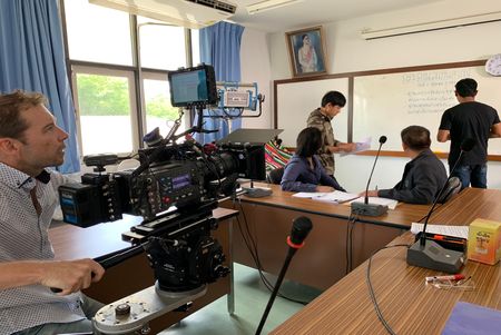 A reenactment of a group of people conducting research on the students who took the Embassy of Myanmar in Central Bangkok under siege in 1999. (©2019 MCN International Pte Ltd. All Rights Reserved.)