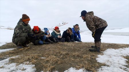 John Pingayak teaches the younger generation their Cup'ik culture and heritage. (National Geographic)