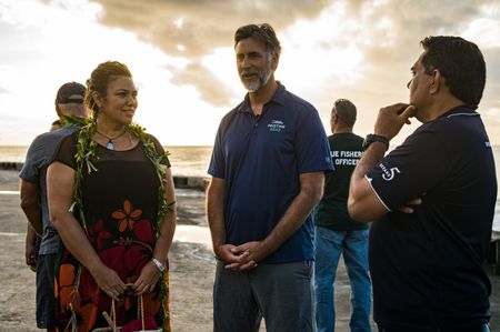 Brendon Pasisi (right) and Coral Pasisi (left) welcome National Geographic Pristine Seas expedition leader Ryan Jenkinson (center.) National Geographic Pristine Seas explored the marine ecosystem in Niue -a small island nation in the tropical Pacific. Local and international scientists surveyed the ocean to understand its health and biodiversity. Thanks to local leadership, traditional knowledge, and strong science, the country has been able to protect large swaths of its marine environment. (National Geographic/Nova West)