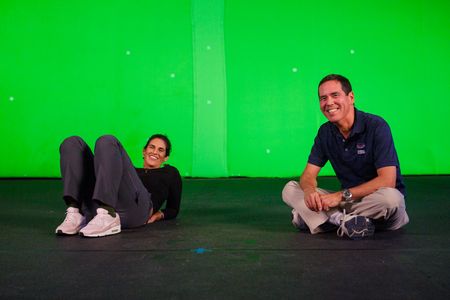 Diva Amon and Stephen Kajiura taking a break during the studio lab shoot. (National Geographic/Aubrey Fagon)