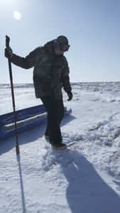 Sonna Boy helps his grandfather collect wood. (National Geographic/Matt Kynoch)