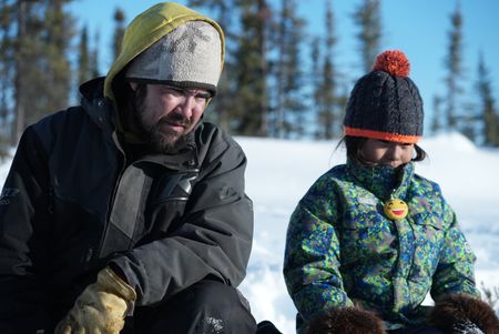 Tig Strassburg with his daughter Sophie Strassburg, setting beaver traps. (National Geographic/Pat Henderson)