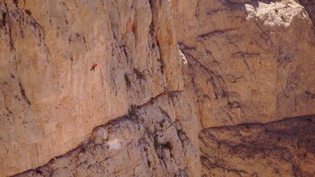 Alex Honnold free solos Les Rivieres Pourpres.  (photo credit: National Geographic)