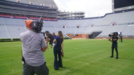 Christian Cooper assists rator trainer, Amanda Sweeney, with Independence's pre-gameday flight practice. (National Geographic for Disney)