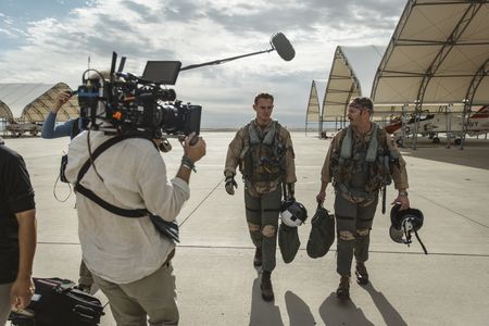 DOP Jon Southgate-Sayers films student LTJG Evan Morris and his instructor as they return from a flight. (National Geographic/Freddie Claire)