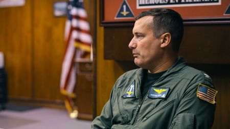 Captain Juston "Poker" Kuch in a debriefing. (Credit: National Geographic)