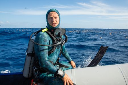 Host, Bertie Gregory, waiting for the opportunity to dive.  (credit: National Geographic/Adam Boyle)