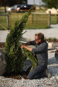 Charles Pol and Andrew Hutton work on the wiring for the Robot Garden system. (National Geographic)