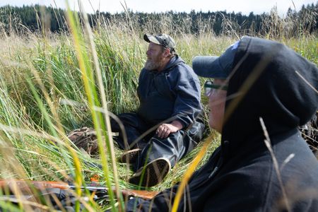 Tim 'Curly' Leach and Mary Miller duck hunt with his dog, Junior. (National Geographic/Robert Jolley)