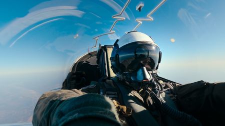An instructor assesses a student from the rear seat of the jet. (Credit: National Geographic)