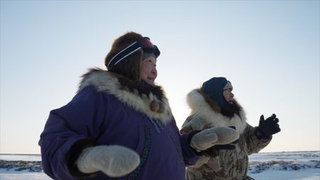 Teresa and John Pingayak in the tundra of Chevak in the winter. (National Geographic)