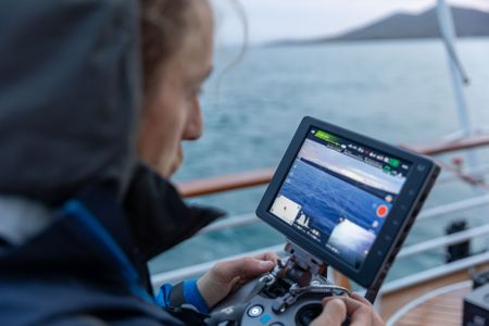 Drone operator Raphael Boudreault-Simard looks at his drone screen while filming for INCREDIBLE ANIMAL JOURNEYS. (National Geographic for Disney/Ruth Davies)