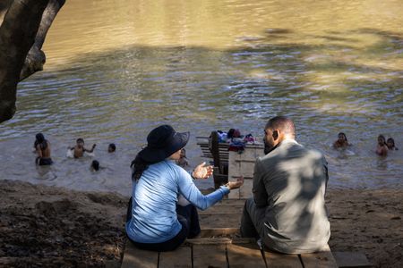 Will Smith, right, talks with expedition leader Carla Perez about life in the rainforest. (credit: National Geographic/Kyle Christy)