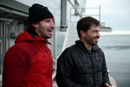 Erick Stackpole and wildlife cinematographer David Reichert aboard the OceanXplorer. (National Geographic/Mario Tadinac)