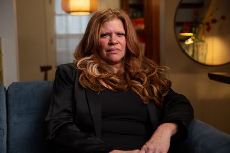 Edye Raines is pictured in close-up portrait during the production of National Geographic's Oklahoma City Bombing: One Day In America. Raines is the mother of Chase and Colton, both of whom were killed while at the Murrah Building day care facility. On April 19, 1995, America experienced the deadliest domestic terror attack in its history. Thirty years later, this series tells the story of that day told only by those who lived through it – the people of Oklahoma. (National Geographic/Brandon Widener)