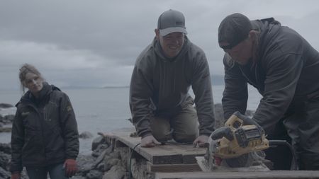 Sarah McDonald, Troy Brockway, and David Squibb construct a ramp from the beach up to Troy's property. (National Geographic/Gil Cano)