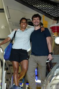 Asha De Vos and Eric Stackpole smile on the stairs in the sub hangar. (National Geographic/Mario Tadinac)