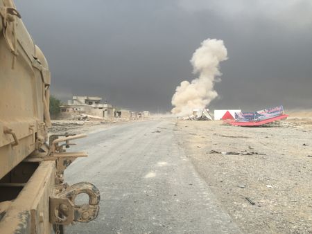 QAYARRAH, IRAQ - After leaving Qayarrah, ISIS sets oil fires as a parting gift for the villagers. (photo credit: Junger Quested Films LLC/Nick Quested)